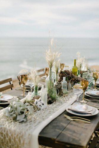 bohemian wedding decorations macrame tablerunner with glass bottles succulents and pampas grass john schnack