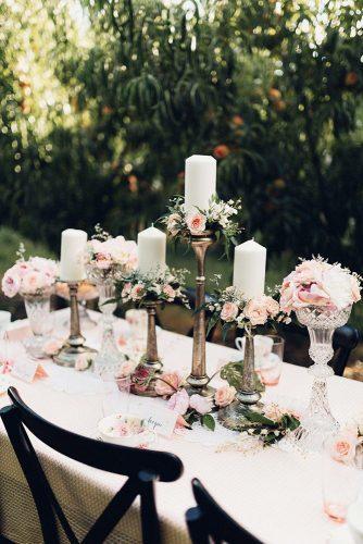 bohemian wedding decorations tall candles with flowers small roses miss gen