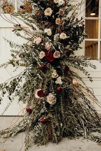 bohemian wedding decorations pale and dark red roses a lot of greenery details phil chester