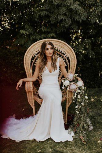 bohemian wedding decorations bride bohemian chair with cascading protea flowers lauren scotti