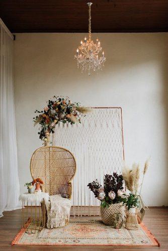 bohemian wedding decorations bohemian chair macrame backdeop pampas grass flowers and carpet lauren rae photography