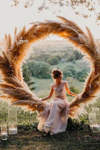 bohemian wedding decorations round shaped pampas grass bridal altar decorated with candles maria_zhandarova