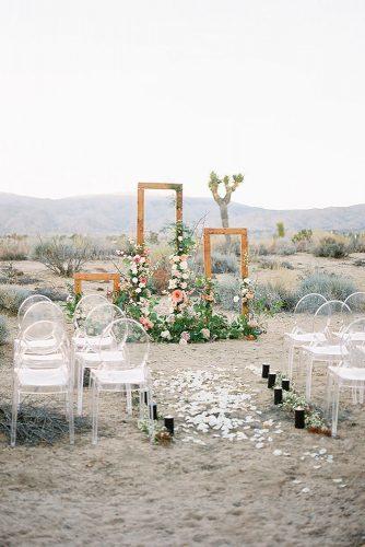 bohemian wedding decorations outdoor ceremony with flowers and greenery acrylic chairs heather anderson photo