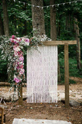 bohemian wedding decorations simple wooden arch with pink flowers and macrame greenery we laugh we love