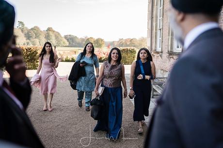 guests arrive at St Giles House wedding
