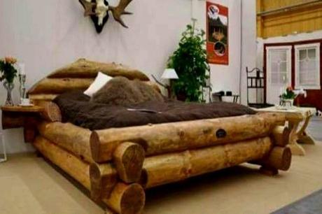 A Bed Made From Wooden Logs
