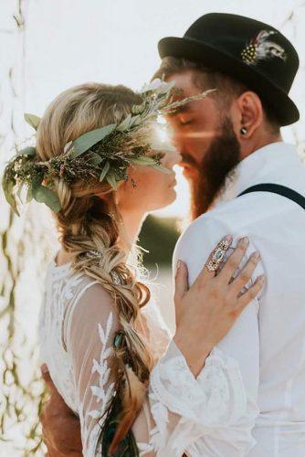 bohemian wedding look bridal jewelry greenery crown groom in black hat with feather décor blissanddelight photoandfilm