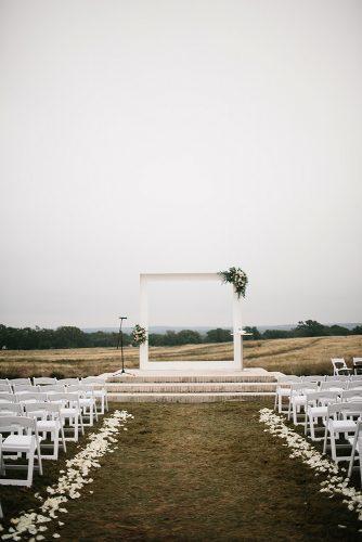 minimalist wedding decor all white outdoor ceremony square wedding altar with natural rachel meagan photography