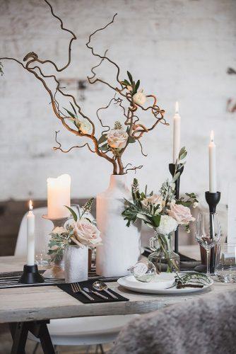 minimalist wedding decor white and glass vaces with roses and branches on table thesmallthingsco
