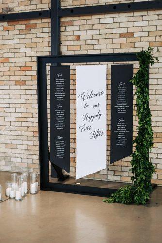minimalist wedding decor signs black white tableplan simple candles and greenery florido weddings