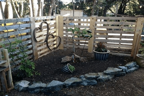 A Fence Made From Wooden Pallets