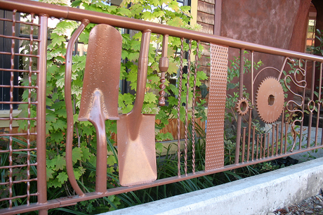 A Fence Made From Metal Parts