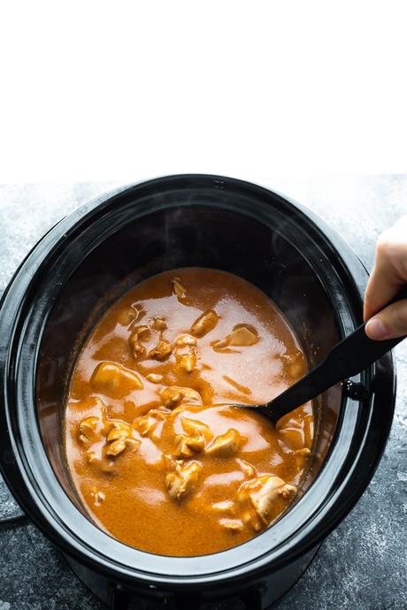 overhead view of slow cooker butter chicken in the crockpot