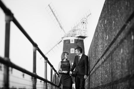 bride and groom walking at their cley windmill wedding