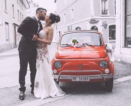 how much does a wedding photographer cost beautiful newlyweds kissing near car