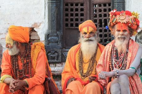 Three Men Wearing Orange Tradition Clothes