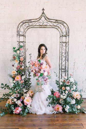 natural wedding décor minimalist arch with flowers and greenery ourstorycreative