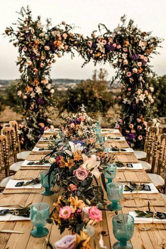 rust wedding color outdoor reception with bright flowers woodland table claudia_gerhard