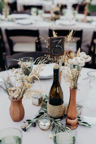 rust wedding color centerpiece glass bottles original vases with dry flowers briana morrison