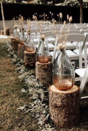 rust wedding color aisle with wooden stands and vases with pampas grass autumn nicole photo