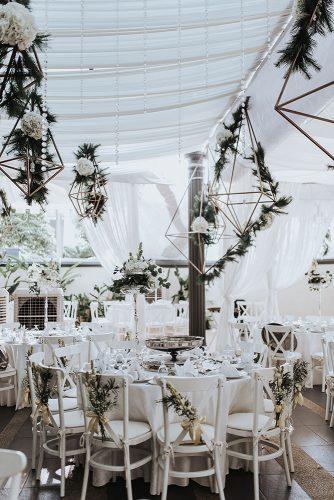 modern wedding decor ideas stylish reception under white tent with greenery and hanging geometry jasmine abdullah