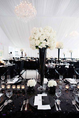 modern wedding decor ideas reception white tent and flowers in tall vase black table and chairs kortnee kate photography