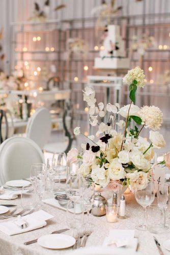modern wedding decor ideas reception with round tables and flower centerpieces purpletreephotography