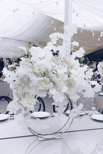 modern wedding decor ideas centerpiece white flowers on round stand nikolaizlobin