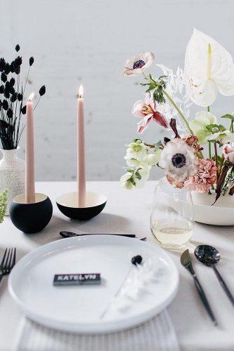 modern wedding decor ideas table with flower centerpieces and pink candles with black candlestick thelightandcolor