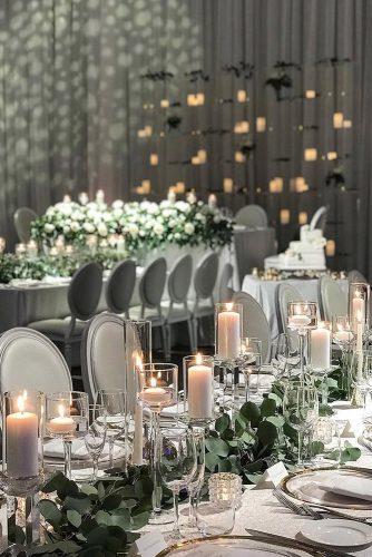 modern wedding decor ideas reception with candles and greenery in gray tones chateau.le.parc
