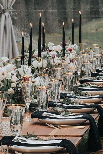 modern wedding decor ideas table with black candles and napkins greenery and white flowers we_the_wild
