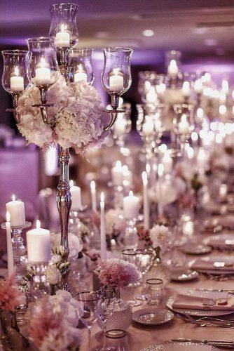 modern wedding decor ideas candle tablerunner with flowers and tall candlestick morlottistudio