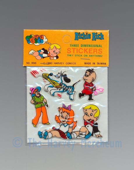 Richie Rich Three Dimensional Stickers, short orange Dollar with newspaper variant front view