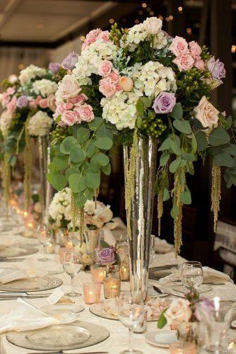 silver wedding decor ideas tall vase woth pink and lilac roses cascading greenery hudson photo arts