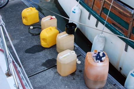 Jerry cans lined up on the dock