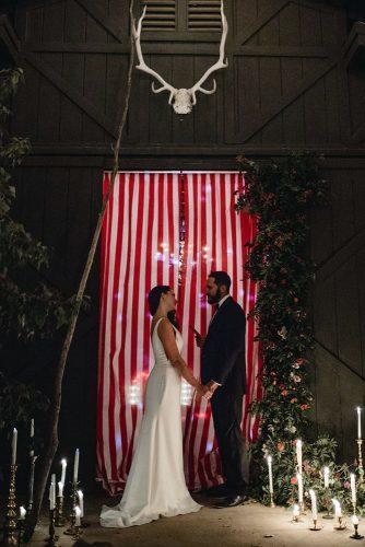 independence day wedding 4th of july ceremony with white red stripes backdrop devin jenkins