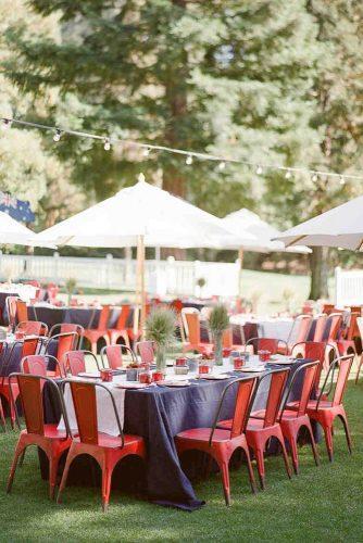 independence day wedding 4th of july blue tablecloth and red chairs outdoor reception ktmerry