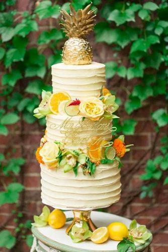 tropical wedding cake trends tropical cake with pineapple cake topper The Dessert First Bakery