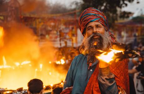 Man Holding Burning Book