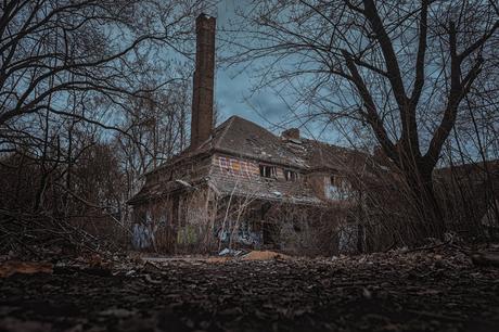 Brick House in the Middle of the Woods Under Cloudy Day Sky