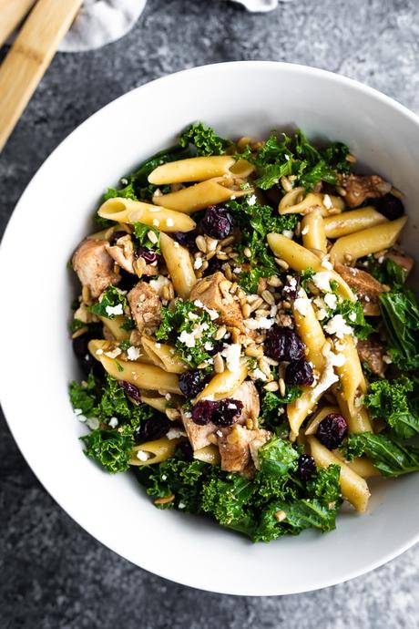 overhead view of chicken pasta salad in white bowl