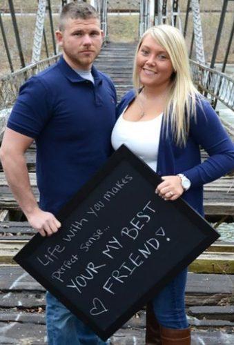 engagement photos dos donts couple with sign You Are Photography Co