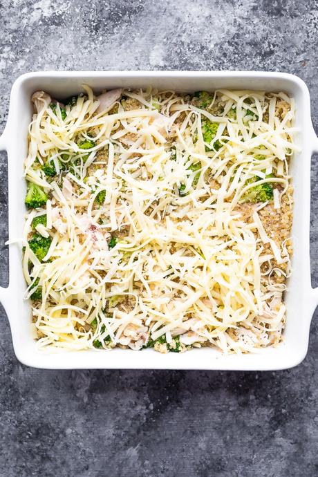 overhead view of chicken broccoli quinoa casserole in baking dish before baking