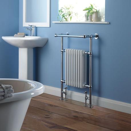 Milano Trent column radiator in a blue bathroom next to a sink