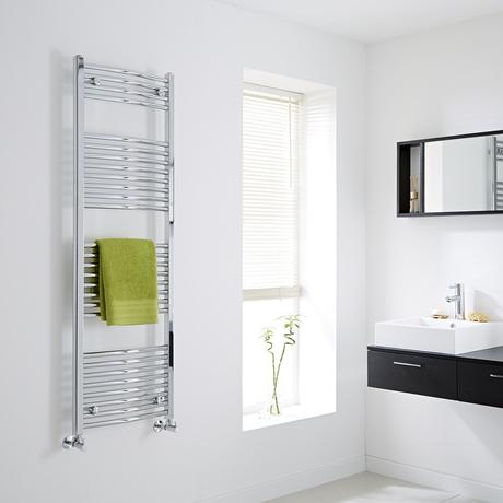 The Milano Ribble Curved heated Towel Rail gloriously gleaming on the wall of a bathroom