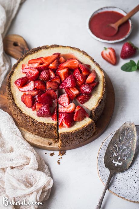 In this Baked Vegan Cheesecake, a gluten-free and paleo graham cracker-style crust encases a sweet and creamy vanilla cheesecake filling. Coconut yogurt and cashews create the perfect texture to mimic a classic cheesecake.