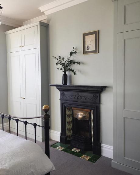 An original Edwardian fireplace in a bedroom.