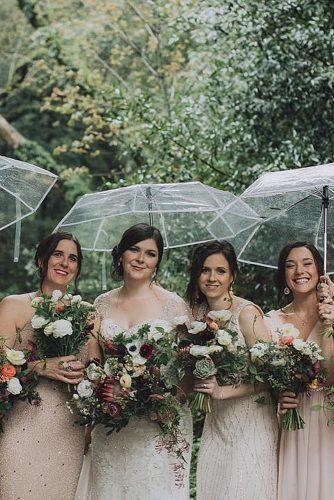 spring weddings bride and bridesmaids with umbrellas