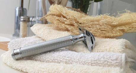 Safety razor on a towel in the bathroom
