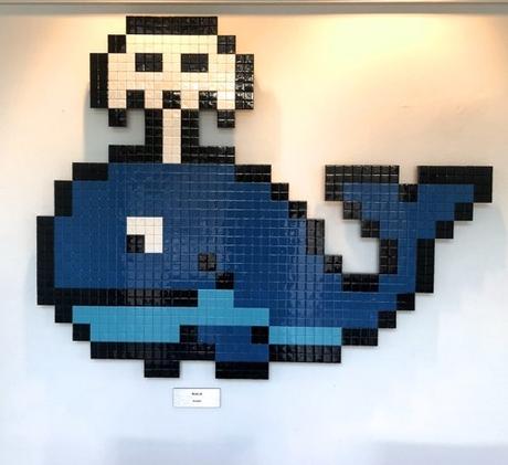 whale with spout by artist know as invader